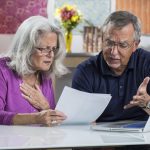 couple looking at paperwork.